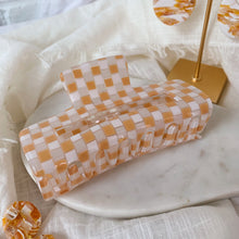 Load image into Gallery viewer, Orange Checkerboard Claw
